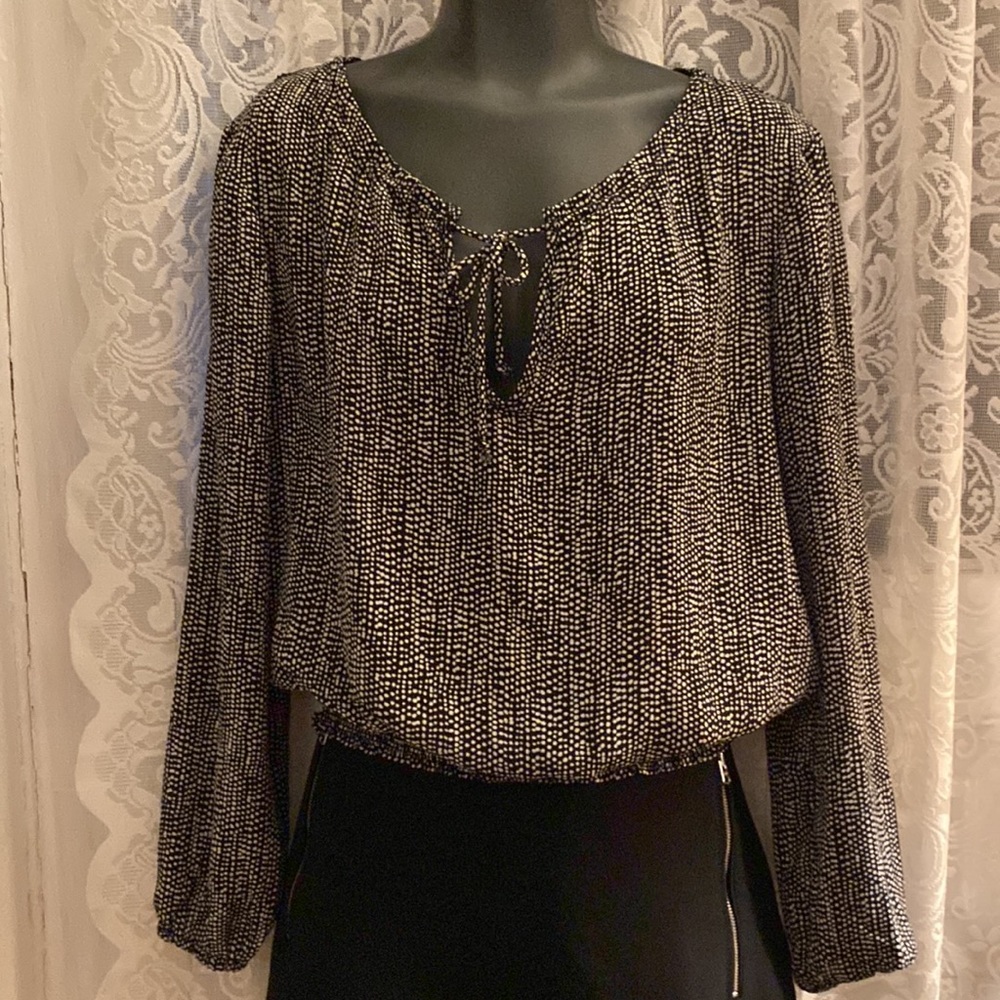 Divided black and white long sleeve blouse.